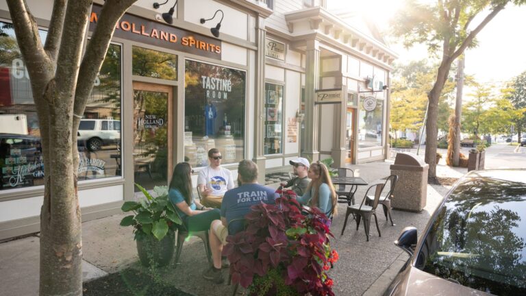 A group of friends enjoying drinks outside of New Holland Spirits.