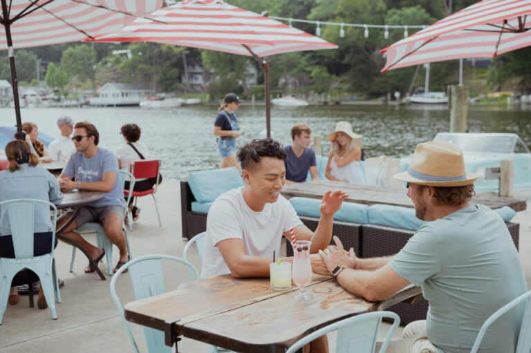 A couple enjoying cocktails at The Old Boat House.