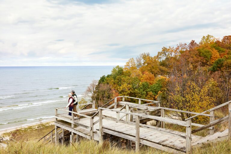 A couple looking out at Laketown Beach.