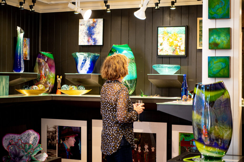 A woman browsing art displayed at J. Petter Galleries.