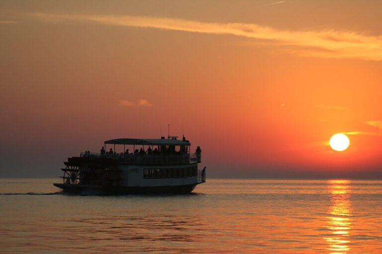 The Star of Saugatuck sailing during sunset.