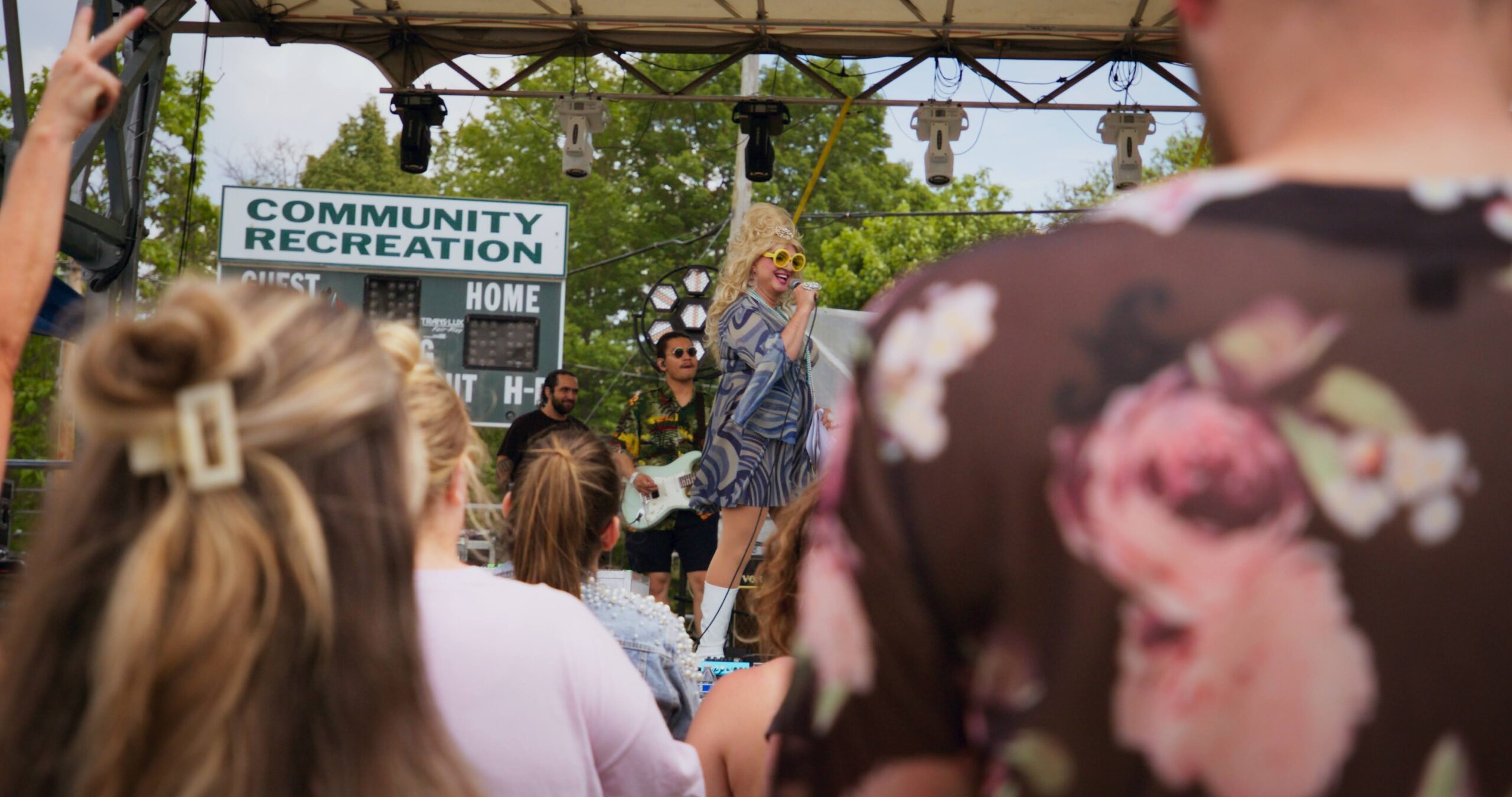 An audience watching performers at the Saugatuck Pride Festival.