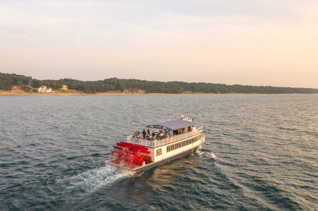 An aerial view of the Star of Saugatuck sailing down the river.