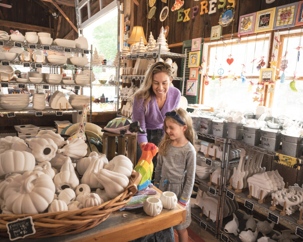 A woman and her daughter selecting a piece at Express Yourself Art Barn.