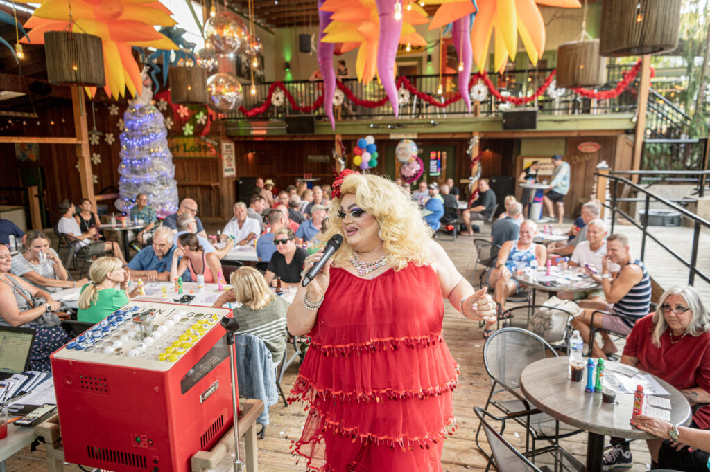 A drag queen hosting bingo at The Dunes Resort.
