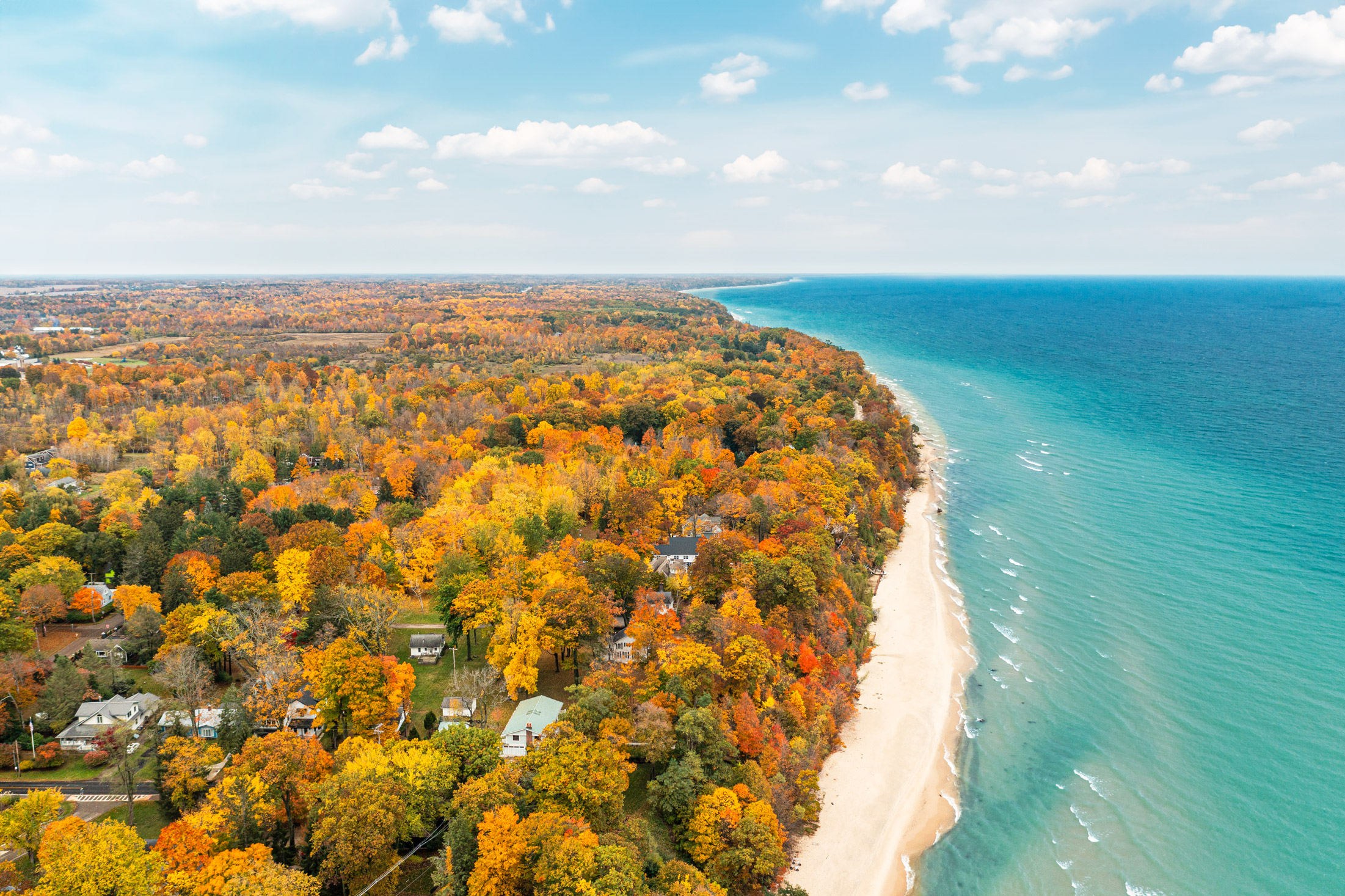 An aerial view of the shoreline of Lake Michigan in the fall.