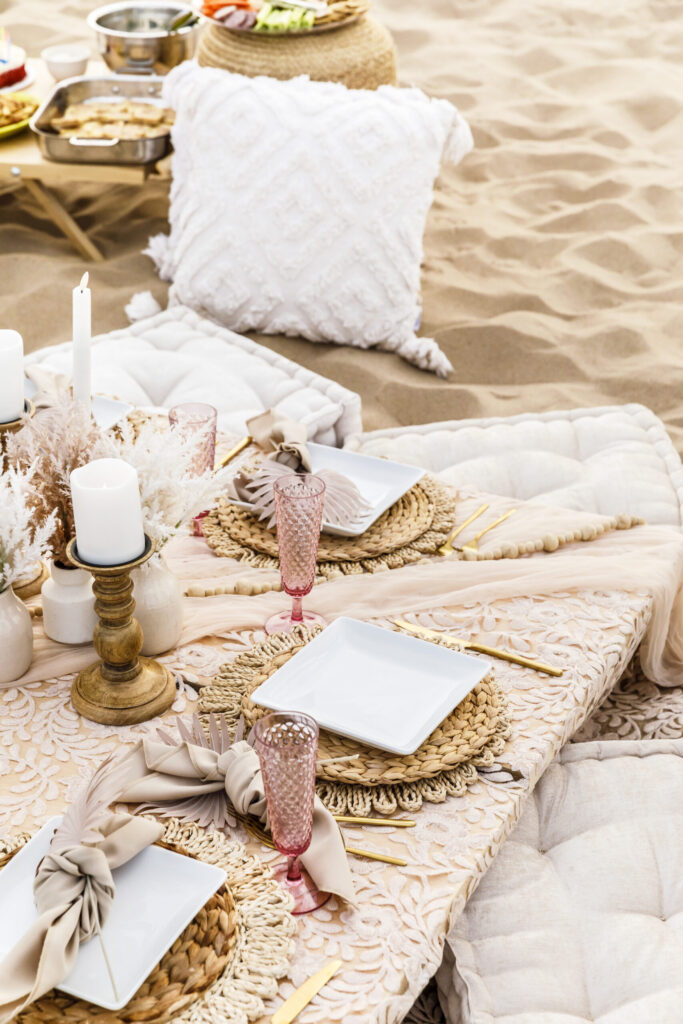 Bohemian serveware laid out neatly on Oval Beach for a luxury picnic set up by Sincerely, K & J.