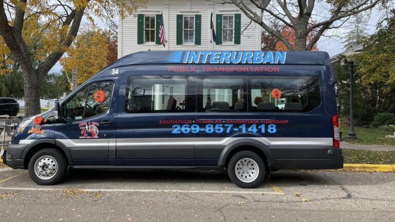 The Interurban bus parked on the street in downtown Saugatuck.
