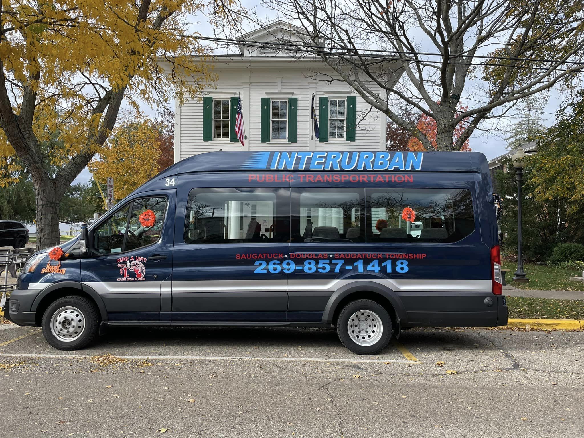 The Interurban bus parked on the street in downtown Saugatuck.