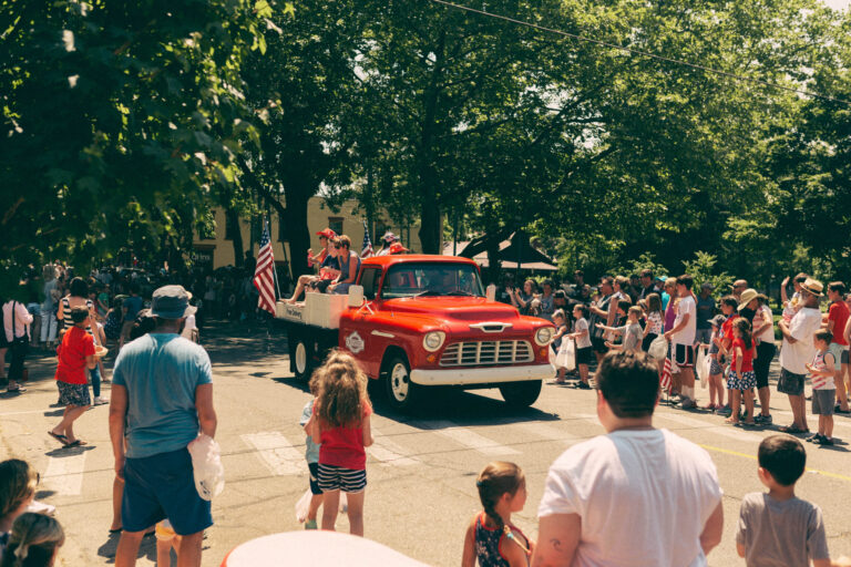 People celebrating the 4th of July Parade on Butler St..